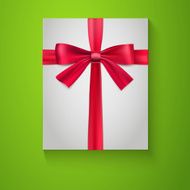 Gift wrapping with red bow and ribbon top view