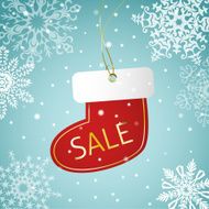 Christmas sock sale tag on a snowy background