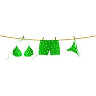 Bikini and boxer shorts hanging on rope N4