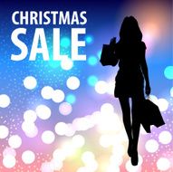 Beautiful woman with shopping bags Christmas background