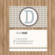 Business card with alphabet letter on a wood background N25