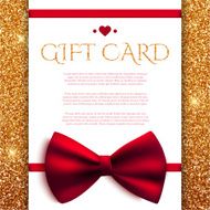 Gift card with red bow on golden glitter background