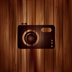 Digital photo camera icon Wooden background