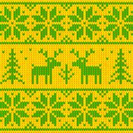 Green and yellow sweater with deer ornament