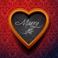 Marry Me written by chalk on heart shaped board