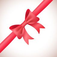 Big shiny red bow and ribbon on white background