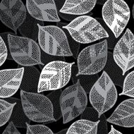 Monochrome seamless pattern of abstract leaves on a black background