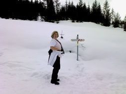 woman in the snowy mountains on the route