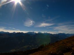 sun rays over the alpine mountains
