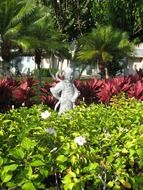 Japanese warrior statue in flower garden