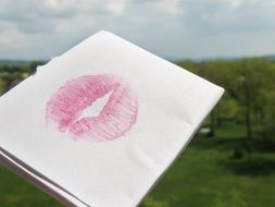 trace of lipstick on a white paper