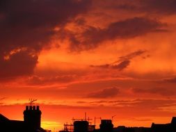 chimneys silhouettes at sunset