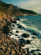 the waves near the rocky coastline