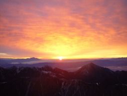 sunrise on the horizon above countryside