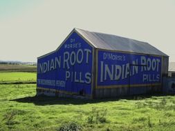 Barn with advertisement on a field in Australia