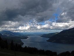 scenic stormy sky above thunersee lake, switzerland