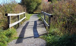 wooden bridge over a ditch in the countryside