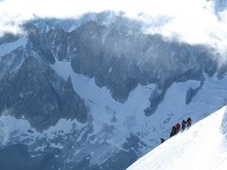 climbing a snowy mountain