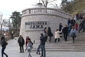 people at entrance to Postojna Cave Park, slovenia