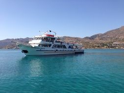 white yacht sailing on blue water