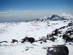 Distant view of the snow-covered Kilimanjaro volcano in Africa