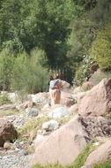 Mother with baby near the river in Morocco