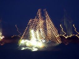 sailing boat in the glare of light