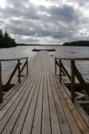 long wooden pier on the river