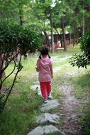 little girl i the park path