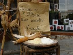 on the chair is corn, corn meal and the inscription