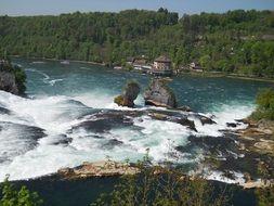 top view of the Rhine Falls in the background of the picturesque landscape