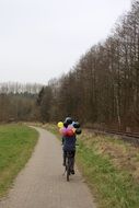 girl цшер balloons on bike