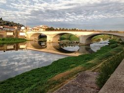 stone bridge over the water in Florence