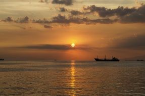 distant view of the ship at sunset