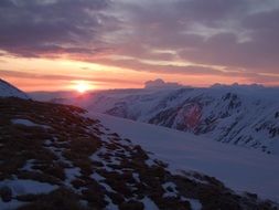 bright sunset over the snow-capped mountains in Bulgaria