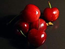 glossy ripe cherries