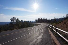 Landscape with the sun on the road