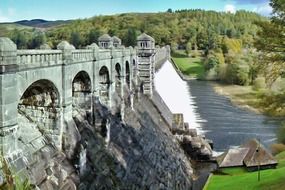 old stone bridge over a river under blue sky