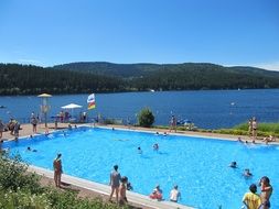 the view from the pool on the lake and the Black Forest