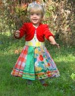 girl in a bright dress on nature