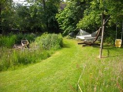 hammock and swing in summer garden