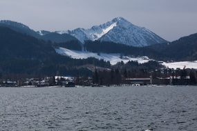 Lake view on background of snowy mountains