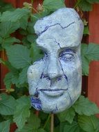 concrete mask in the garden