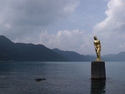 golden statue on tazawa lake