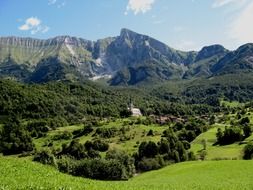 village and church in beautiful mountain landscape, slovenia, kobarid