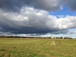 landscape of cloudly sky over the meadow