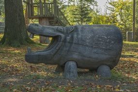 Wooden pig figure in the forest