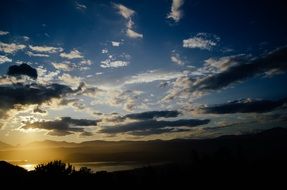 yellow sun and blue sky over the countryside at sunset