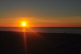 bright orange sunset over the horizon