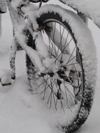 bicycle wheel in snow